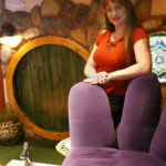 SE-COMMERCIALCENTER--Paula Sadler, owner of A Harmony Nail Spa and president of the Commercial Center Business Association, stands next to a giant purple hand chair, while a spa foot bath runs in the foreground. The "hobbit hole" (background) is one of the features of the spa.  Commercial Center is located at 953 E. Sahara Ave. 6/6/08 View photo by Dale Dombrowski
